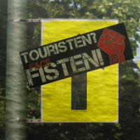 Tourists, Raus! Berlin Rebels Ignite "A Bonfire Of Automobiles" 